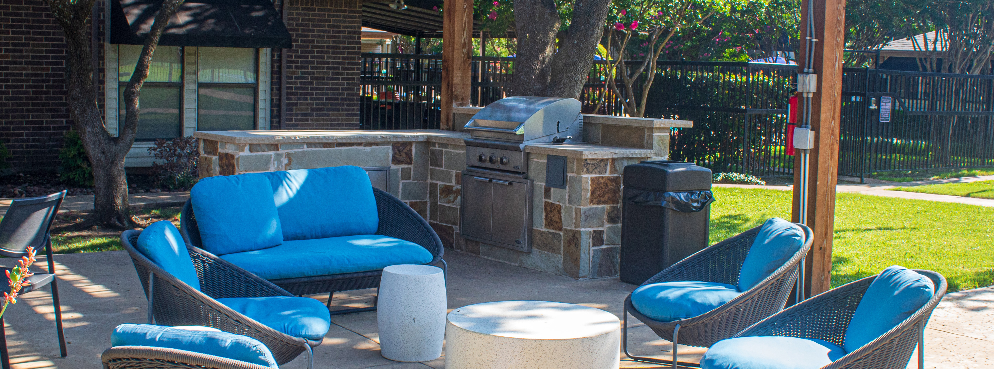 Comfy lounge with grilling near pet park and tennis courts. Adjacent to the pool near the office.